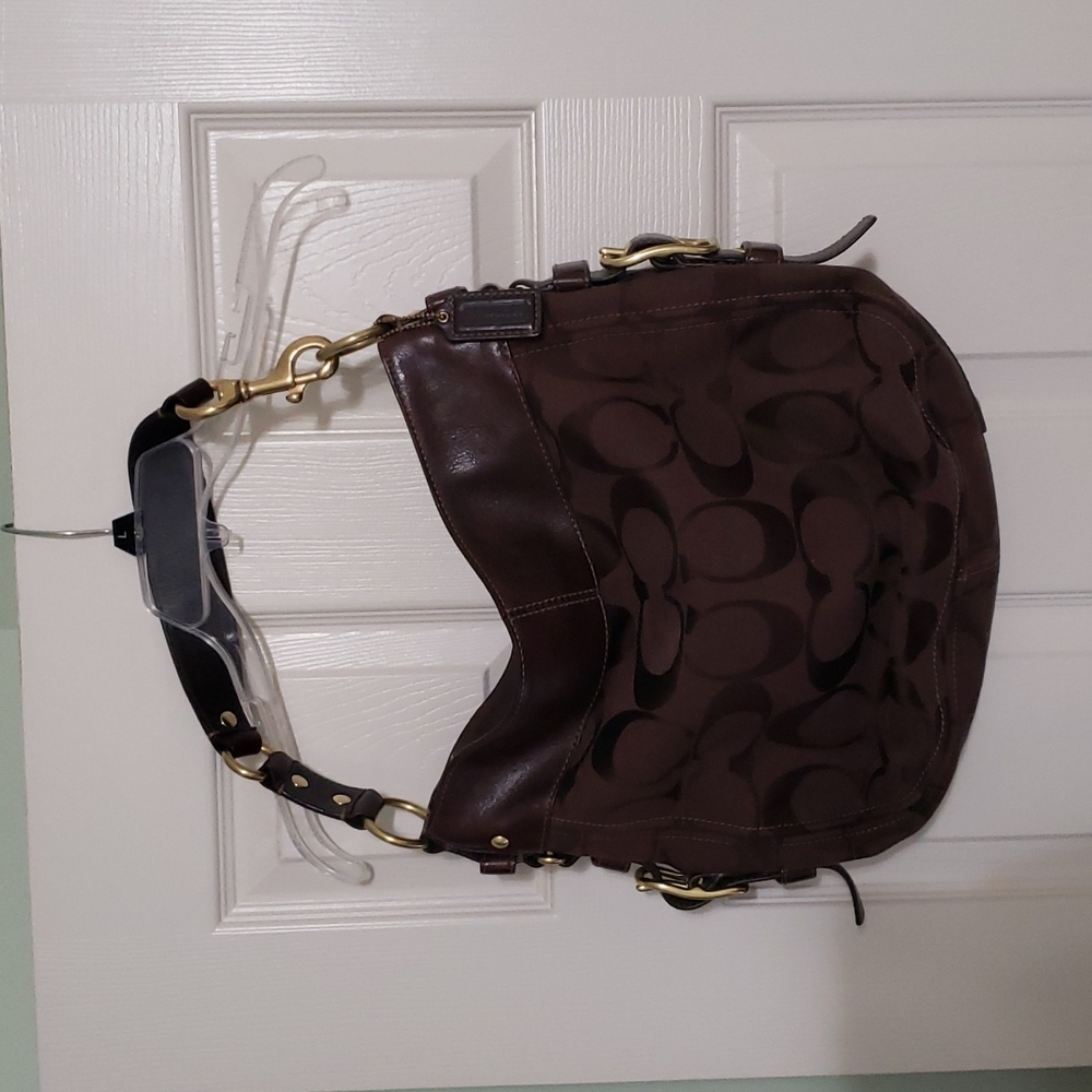 Chocolate brown Coach purse with lovely purple interior.  Medium sized